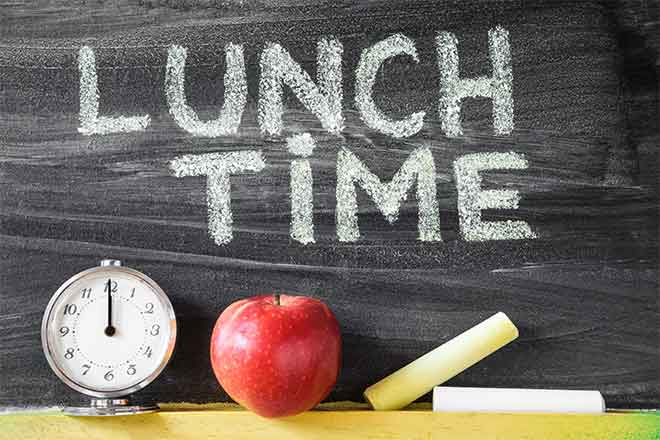 Lunch time chalkboard with apple and clock